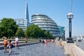 The London Southbank on a sunny summer day with a view of the City Hall