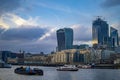 London southwark buildings with cloudy skyline with calm water