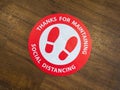 A restaurant floor sign for maintaining social distance. Royalty Free Stock Photo