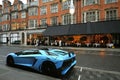 London street in Mayfair with a luxury car in front of a restaurant