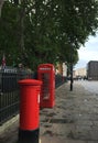 London street after rain with red telephone booth and mail box Royalty Free Stock Photo