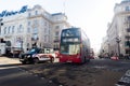 London street scene with crowds of people and bussy traffic