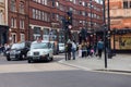 London street scene with crowds of people and bussy traffic Royalty Free Stock Photo