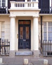 London Sussex gardens area, house entrance with dark door and columns Royalty Free Stock Photo