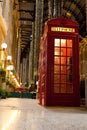 London symbol red phone box in illuminated street Royalty Free Stock Photo