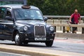 London Taxi on London Bridge Royalty Free Stock Photo