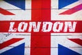 London text on old designed grunge british flag