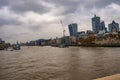 London thames skyline with clouds and water