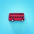 London traditional red double decker bus over blue background