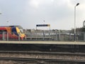 London Train going past Wandsworth Town Train Station at speed