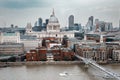 London on a typical cloudy day with Saint Paul Cathedral and the Millennium Bridge Royalty Free Stock Photo