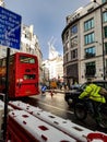 London typicall traffic street road winter wet after snowing dark grey sky no clouds clear uk britain england London