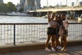 London, U.K. August 22, 2019 - group of young friends taking selfie on Thames river, visiting London