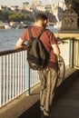 London, U.K. August 22, 2019 - Young man from the back, businessman standing at the Thames riverside in the city of London
