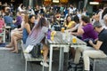 London, U.K. August 23, 2019 - Young people enjoy and relax at an outdoor cafe terrace in London, at river Thames. Wekeend time Royalty Free Stock Photo