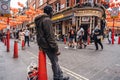 African American man standing next to the award winning Gay Bar in Soho London