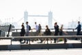 London, UK. Blurred image of Office workers crossing the London bridge in early morning on the way to the City of
