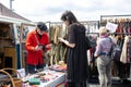 Car Boot Sale by Vintage. Retro festival. People sell vintage clothing, goods jewellery, homeware on