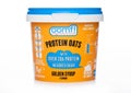 LONDON, UK - APRIL 01, 2020: Cup of OOMF protein oats with golden syrup flavour on white