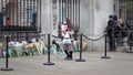 Public laying flowers for the death of Prince Philip, the Duke of Edinburgh, at the Buckingham Palace in London Royalty Free Stock Photo