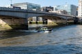 LONDON, UK - APRIL 1, 2019: The Marine Police Force Thames River Police, Patrolling under London Bridge