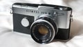 A classic Olympus Pen FT film camera. Takes 35mm half-frame shots.