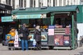 Tourist buying a Belgian waffle at a restaurant food street market stall