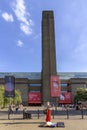 LONDON, UK - AUGUST 2, 2018: Artist and public at the exterior of Tate Modern art gallery Royalty Free Stock Photo