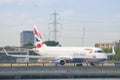 A British Airways Embraer ERJ-190SR taxiing at London City Airport, one of the most challenging in the world to land because of Royalty Free Stock Photo