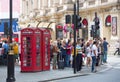 Crowd of people in the Regent street. Tourists, shoppers and business people rush time