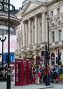 Crowd of people in the Regent street. Tourists, shoppers and business people rush time