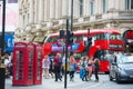 Crowd of people in the Regent street. Tourists, shoppers and business people rush time