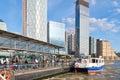 A ferry docks at the Canary Wharf ferry terminal on the river T