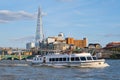 Ferry on the river Thames in London with a view of the Shard skyscraper
