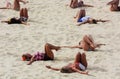 London, UK, August 2012. Group of women doing exercice on a beach volley court