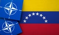 LONDON, UK - August 2022: NATO North Atlantic Treaty Organization military alliance logo on a Venezuela flag