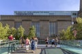 LONDON, UK - AUGUST 2, 2018: People at the famous Millenium Bridge, whit The Tate Modern art gallery in the background Royalty Free Stock Photo