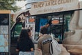 People getting ice-cream from Mr. Whippy van by Tower Bridge, London, UK
