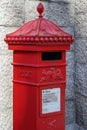 LONDON, UK - AUGUST 22 : Red Royal Mail post box on the southbank of the Thames in London on August 22, 2014