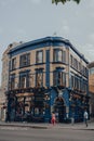 Shipwrights Arms pub located in London Bridge, London, UK, people walking past, motion blur