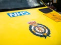 A NHS London Ambulance service sign logo.