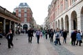 LONDON, UK - AUGUST 14, 2010: unidentified flock of tourists walk aound outside Covent Garden