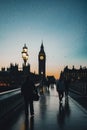 London, UK - 2023: Big Ben at the end of the day with the sunset behind against the light with people passing by. Royalty Free Stock Photo