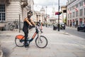 Black Lives Matter protest during lockdown coronavirus pandemic. Man wearing scary mask riding a bike at Trafalgar square