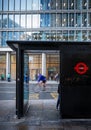 London, UK: Bus stop on Bishopsgate in the City of London with cyclist Royalty Free Stock Photo