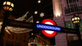 Characteristic sign above entrance to station of rapid transit system London Underground (subway, also The Tube). Royalty Free Stock Photo