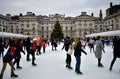 People skating on ice at the Somerset House Christmas Ice Rink. London, United Kingdom, December 2018. Royalty Free Stock Photo