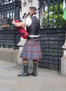 Scottish bagpipe player busker in London Royalty Free Stock Photo