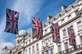 Close up of building on Regent Street London with row of British flags to celebrate the wedding of Prince Harry to Meghan Markle Royalty Free Stock Photo