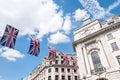 Close up of buildings on Regent Street London with row of British flags to celebrate the wedding of Prince Harry to Meghan Markle Royalty Free Stock Photo